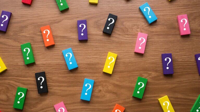a-colorful-wooden-block-with-a-symbol-of-question