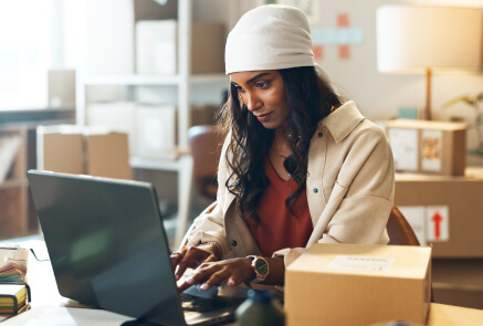 A person checking messages on her laptop