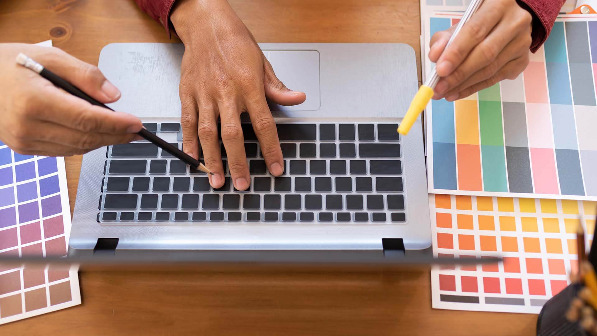 asian-colleagues-designer-drawing-sketches