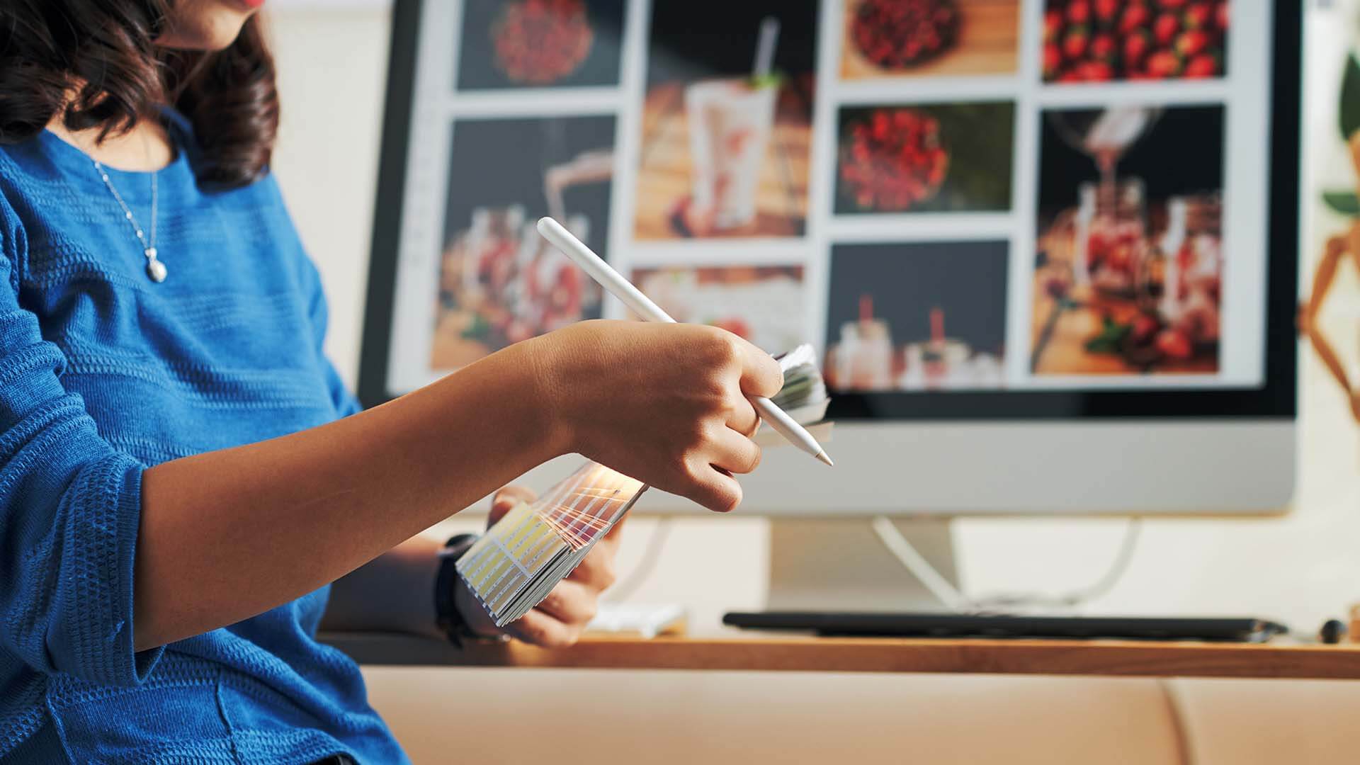 designer-choosing-color-on-color-swatch