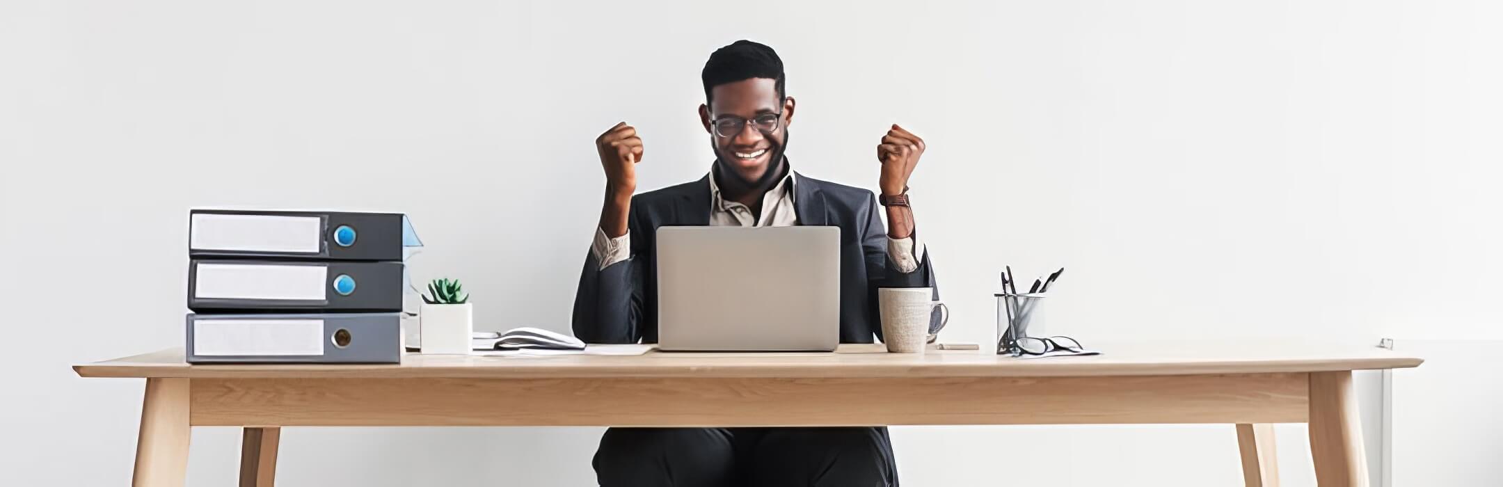 person excited looking at laptop