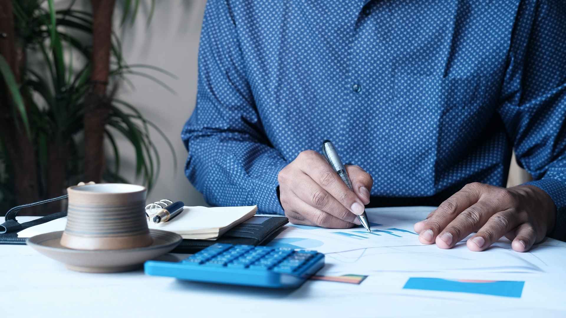 man analyzing the costs and proft margins