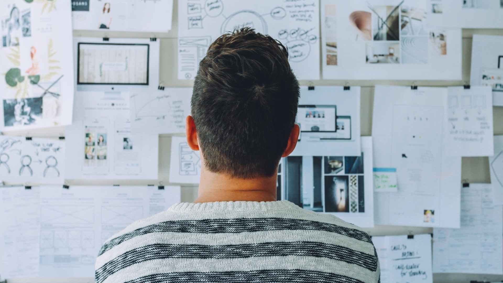 man looking at his vision board