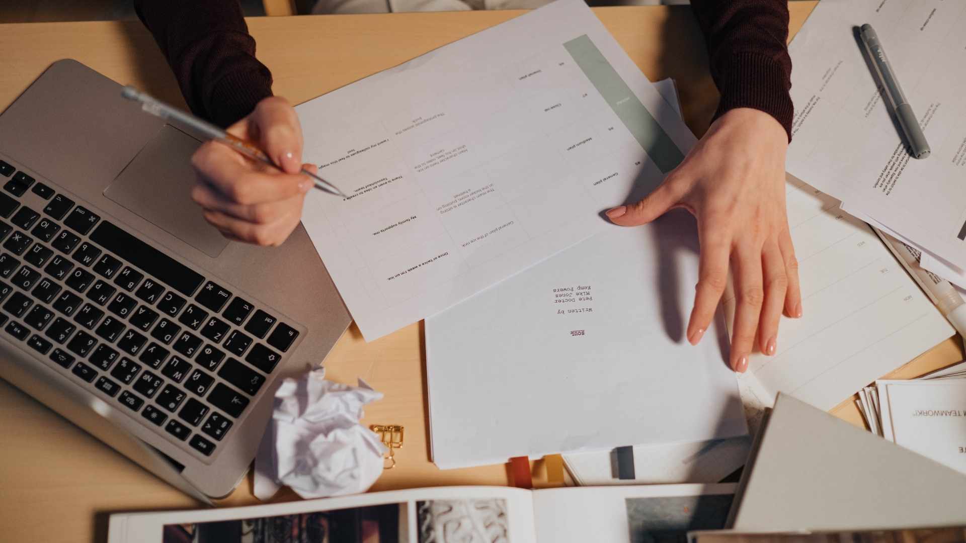 person holding white document paper