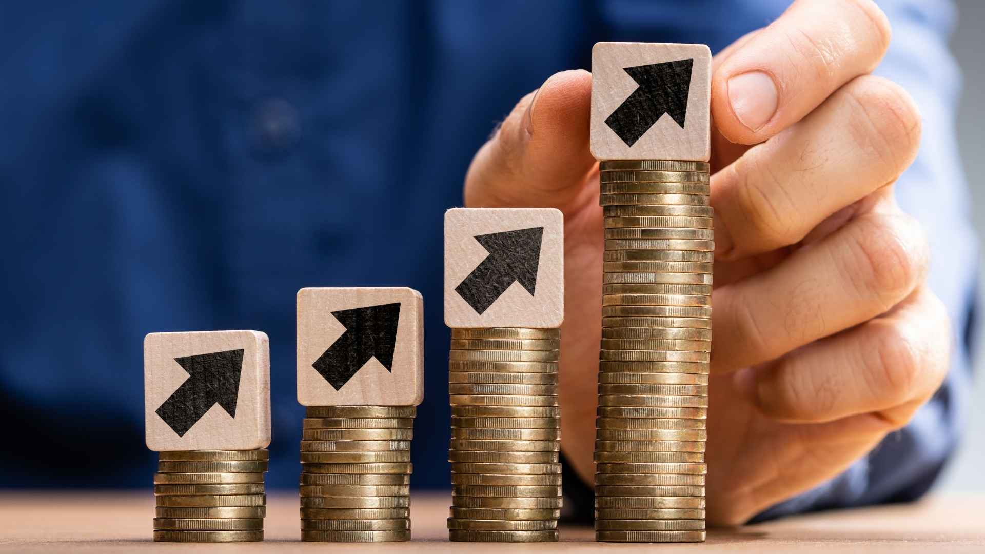 pile of coins with arrow block on top