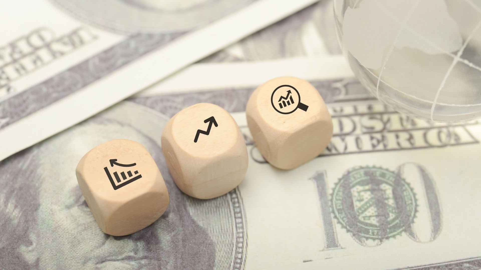 ROI icons in wooden cubes above a dolllar bills