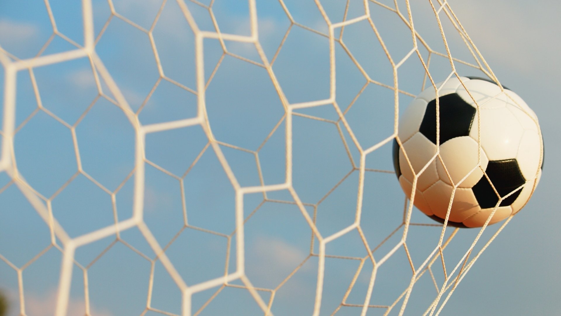 soccer ball hitting the goal