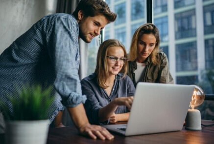 Team seeing something in laptop