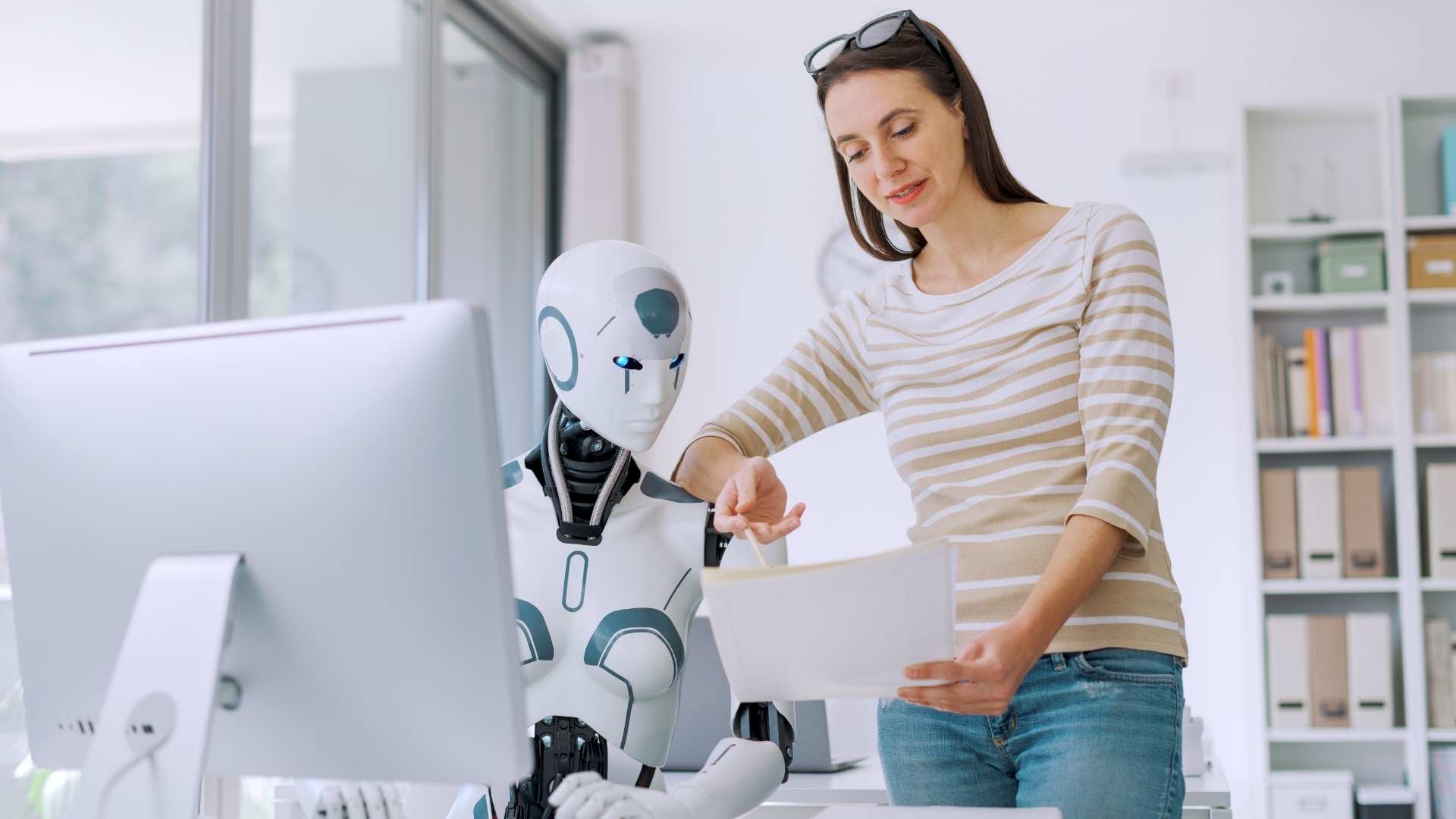 woman and AI robot working together
