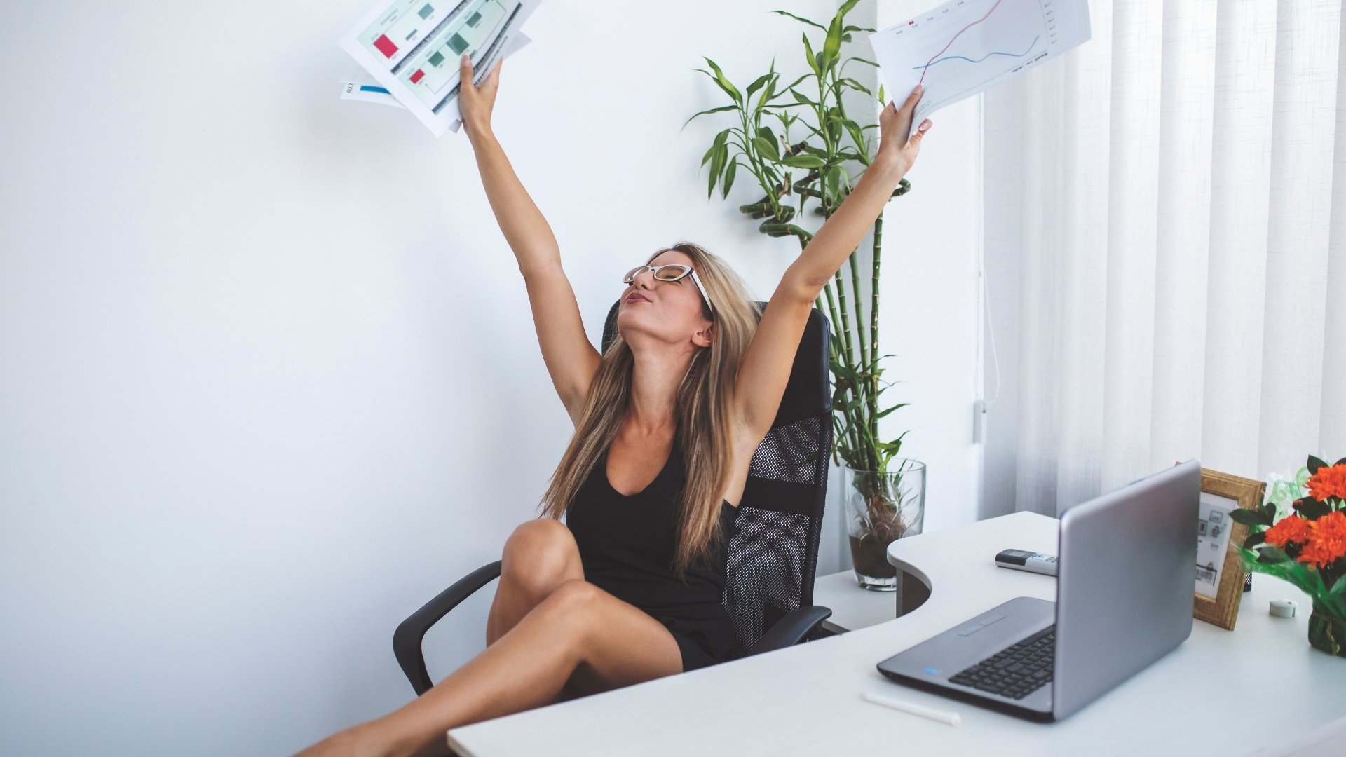 woman ecstatic in her desk