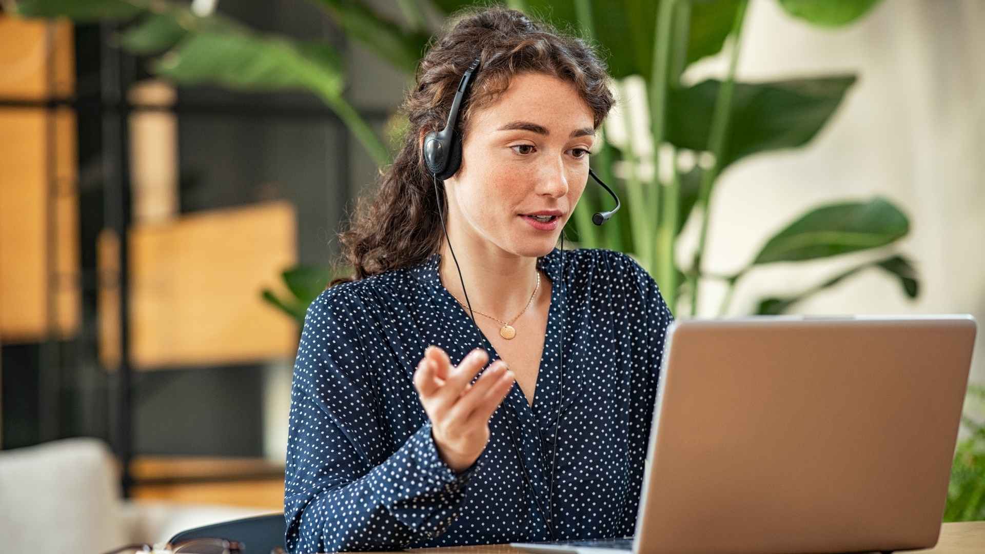 woman on video call using laptop