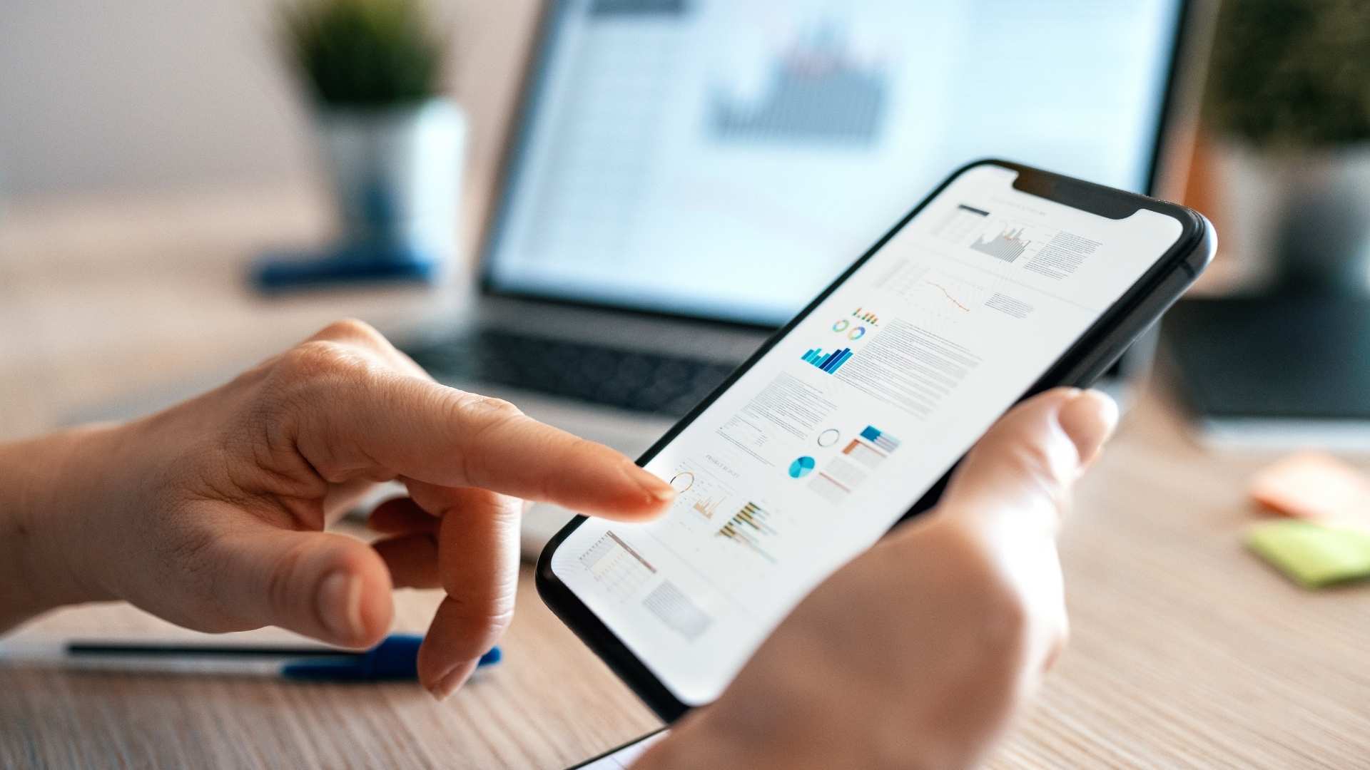 woman using her phone to browse a website