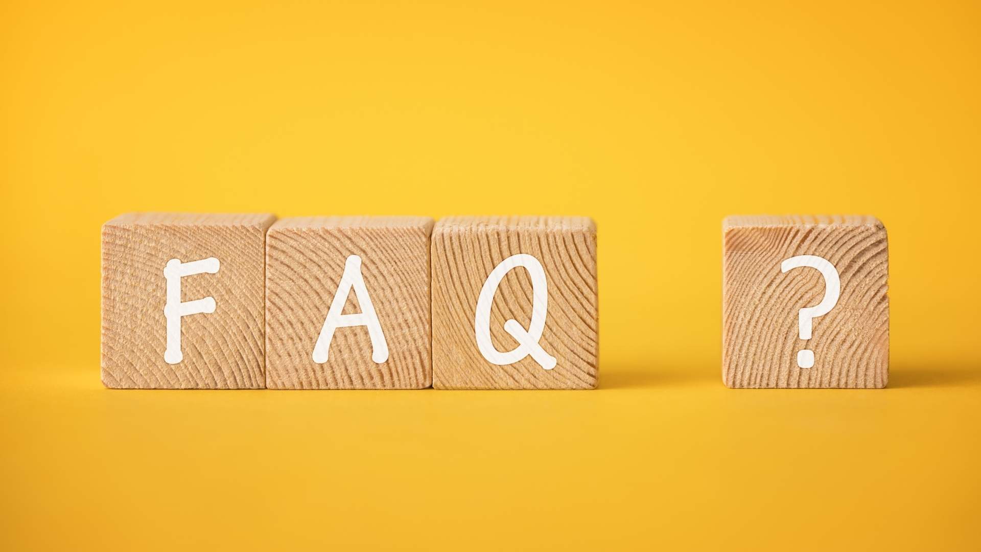wood blocks with the faq letters