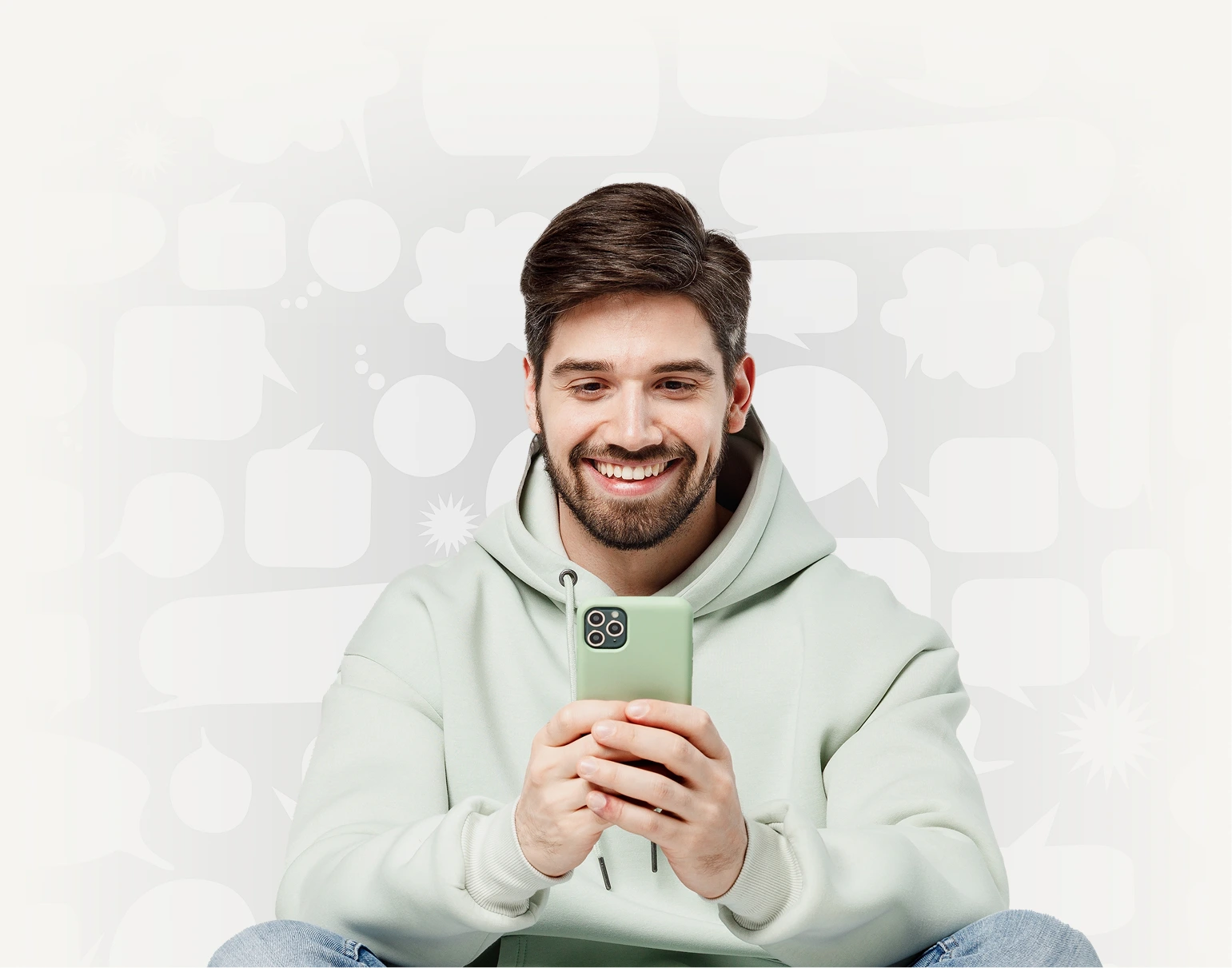 A happy man is using a green phone