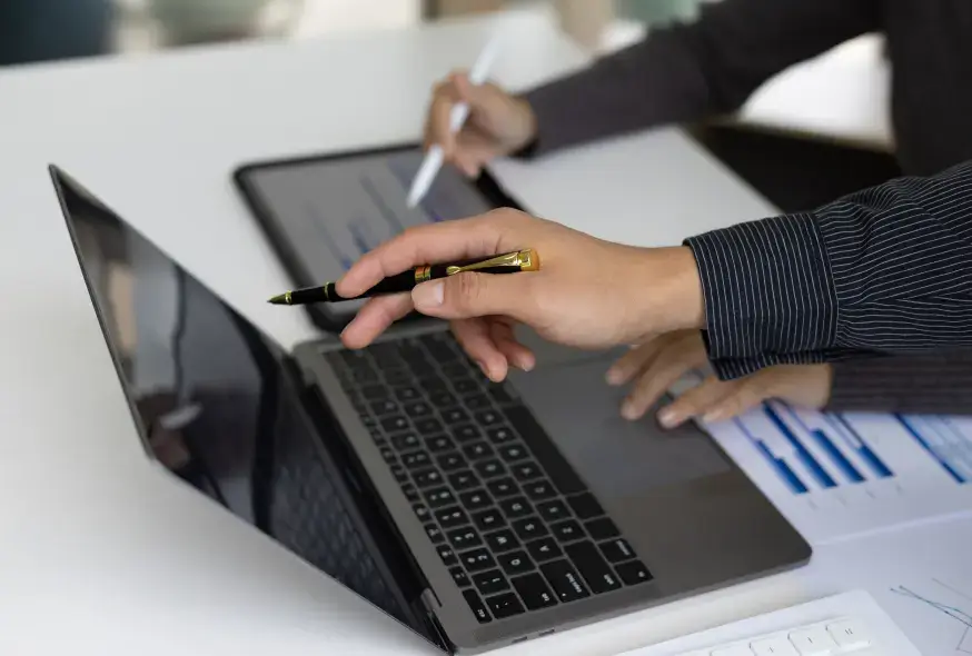man explaining the results on his laptop