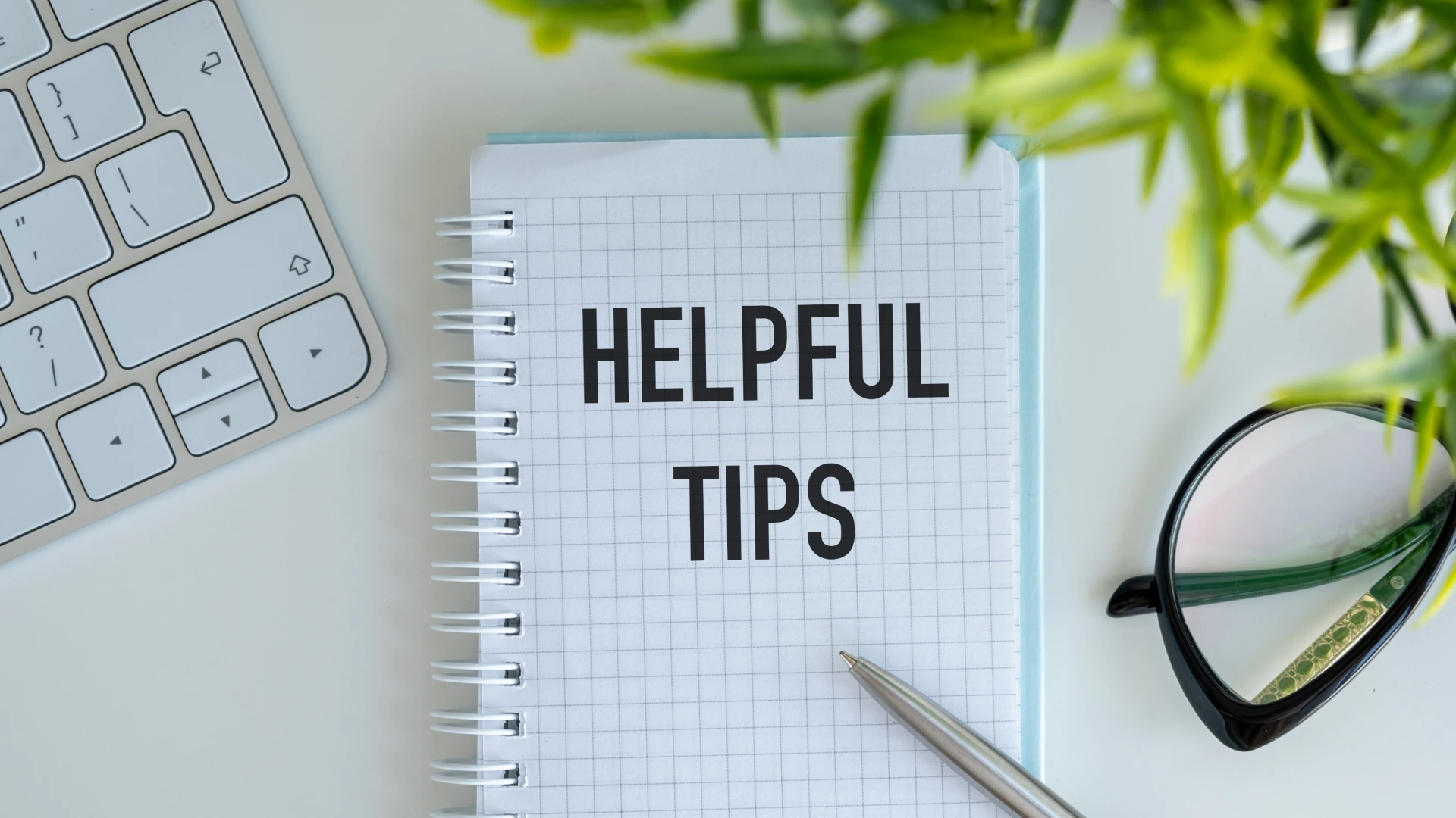 Word text Helpful tips on white paper on office table, business concept